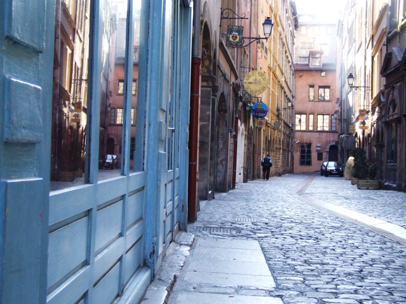 European cobblestone alley with historic buildings